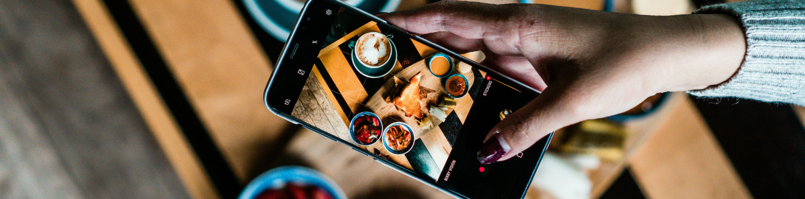 Woman taking a photo of food